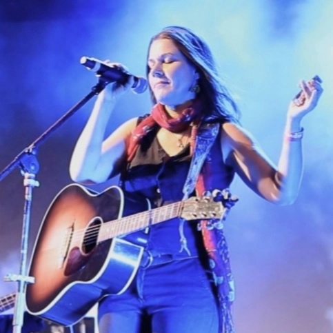 Jackie Meadows performing live music on stage at Brady’s Irish Bar